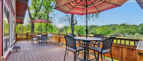 Relax on the spacious deck with shaded seating and tables.