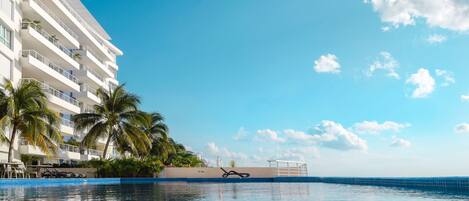 Blue skies over a sparkling pool for your enjoyment