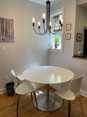 Table with built-in window bench, seats 5-6 adults. Two high chairs available.