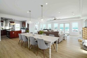 2nd floor features a wrap around balcony, large chefs kitchen, large dining area, bar, and living room