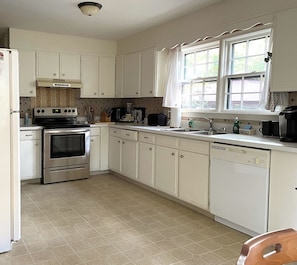 Roomy kitchen, nice and bright w/ new stove & refrig.