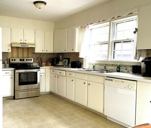 Very roomy and bright kitchen, well equipped, and with new stove & new refrig.