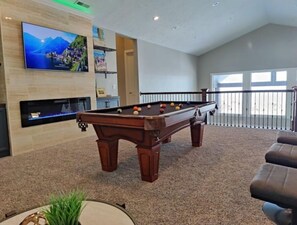 Upstairs loft area with pool table, smart TV and LED fireplace - so much fun!