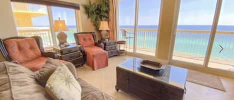 Comfortable living room with large smart TV and unobstructed view of the Gulf 