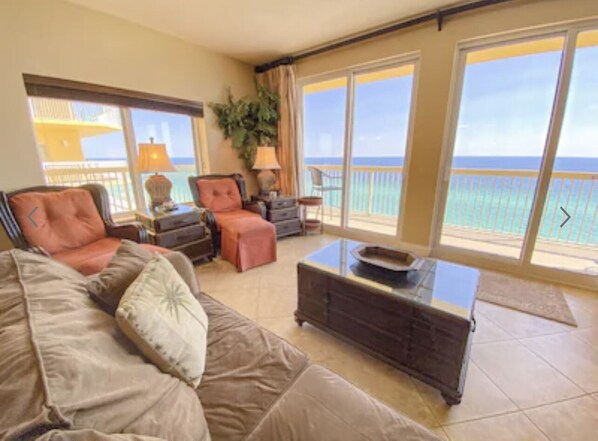 Comfortable living room with large smart TV and unobstructed view of the Gulf 