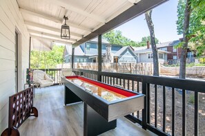 Upstairs balcony for a fun hang out with games and hammock chairs. 