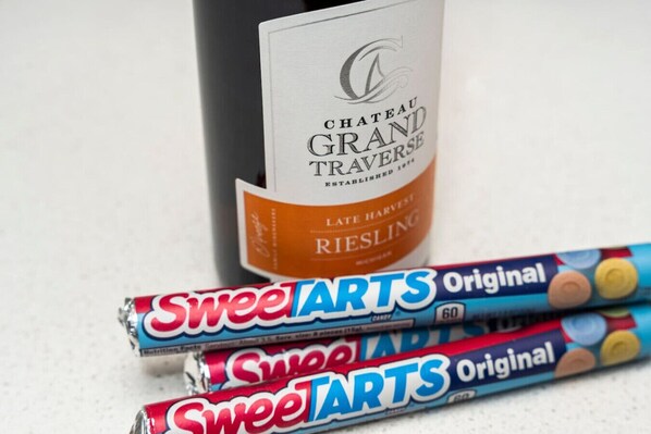 Sweet Tarts in the Sweet Tart Spot! We offer a complimentary bottle of local wine and themed candy!