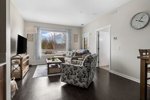 Living room where you can enjoy board games, play Uno with the children, or sit back and watch a movie on the 55 inch smart TV!
