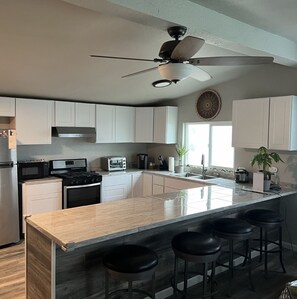  The kitchen opens up to the living room, a perfect way  entertain.