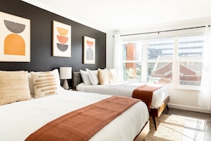Bedroom with 2 comfortable Queen size beds. Smart TV in the bedroom with all the apps you could want. Bathroom directly connected to the bedroom. Dresser and walk-in closet to store your items in.
