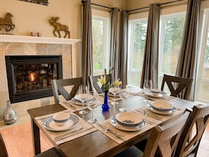 Wonderfully warm and lovely dining area with gas fireplace