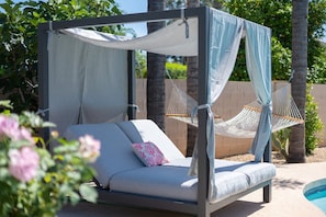 Lounge on the cozy day bed with a drink in hand
