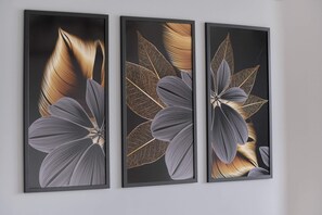 A close-up of elegant floral artwork on the wall, adding sophistication to the space.