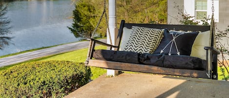 This must be the place!  Relax in the porch swing with peaceful lake view.