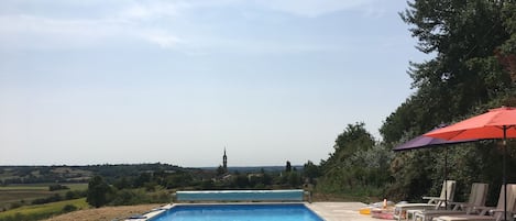 Terrace around the pool with loungers