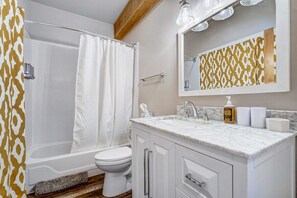 Indulge in a relaxing soak in our luxurious tub, the perfect retreat in our fully equipped bathroom.
