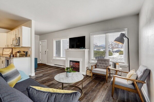 Experience the ultimate in cozy relaxation with our smart TV and warm fireplace - the perfect companions for your night in.
