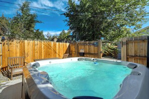 Relax and unwind in the private hot tub, the perfect spot for a soothing soak after a day of exploring Colorado Springs.