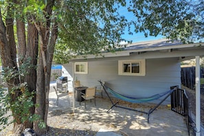 Relax in the shaded backyard with a hammock, perfect for unwinding after a day of exploring.