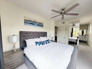 Experience the ultimate in luxury and comfort in the master bedroom of this San Diego townhouse, featuring a plush king-size bed, chic decor, and plenty of natural light for a serene and restful stay