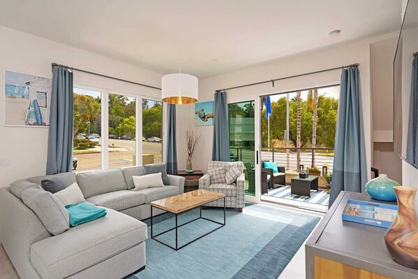 Unwind in style in this spacious and beautifully decorated living room, the perfect place to kick back and relax after a day of exploring San Diego