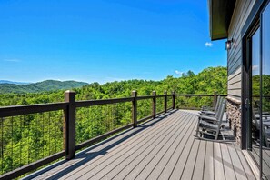 Take in breathtaking panoramic views from the expansive deck, your perfect morning coffee spot.