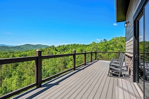 Take in breathtaking panoramic views from the expansive deck, your perfect morning coffee spot.
