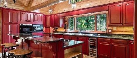 Spacious, airy well stocked kitchen with gourmet appliances