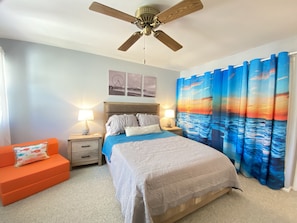 One of the queen bedrooms. Behind that gorgeous curtain, a spacious closet!