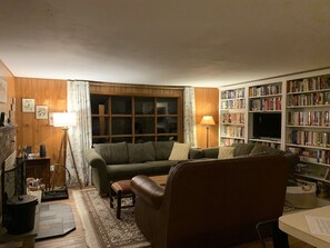 Cozy living room with TV with Netflix, books, and board games for all ages