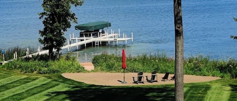 Sand beach area with boardwalk to water