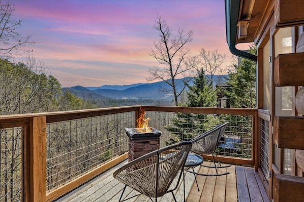 Cozy up by the fire with breathtaking mountain views!