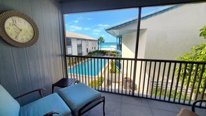 Screened Lanai with View of Beach and Pool