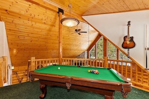 Pool table in loft area.