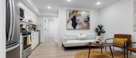 Well-furnished living room in stylish DC apartment