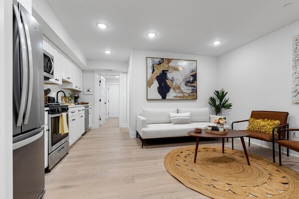 Well-furnished living room in stylish DC apartment