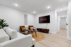 Relaxing living room with a TV and furniture in DC apartment