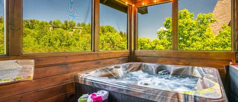 Enjoy a private outdoor hot tub on the screen-in porch!