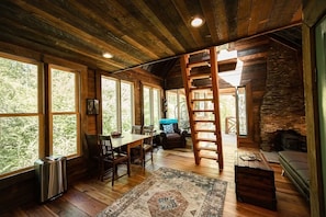 Tiny but light filled, airy, and spacious. So much history in the barnwood.