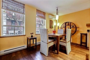 Dining area with teak table and teak & water hyacinth furniture