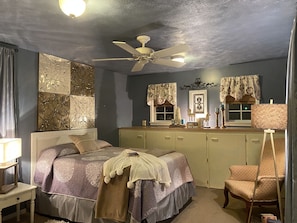 Bedroom in upper portion of treehouse. Decor changes with the seasons.