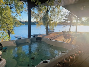 Your own private hot tub with a perfect view of Cedar Lake + table for cocktails