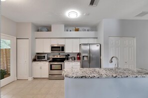 Two ovens, microwave, fridge. 2 pantries.