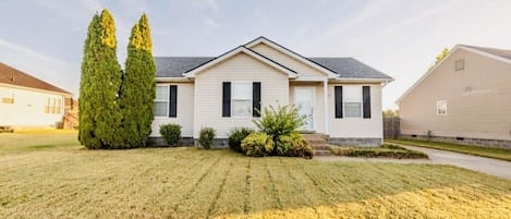 FRONT YARD WITH 2 CAR DRIVEWAY; ALSO STREET PARKING.