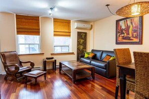 Living room & dining area,  teak wood, leather and rattan furniture from Bali.