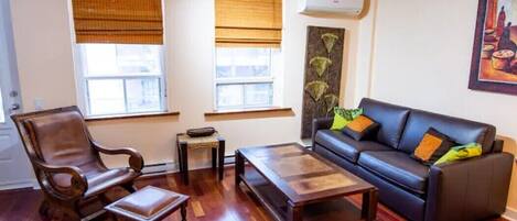 Living room with teak & leather furniture & accessories from Indonesia