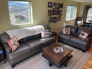 Relax in the living room perfect spot to discuss your adventures from the day! 