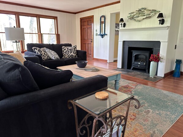 Open living room with electric potbelly fireplace heater