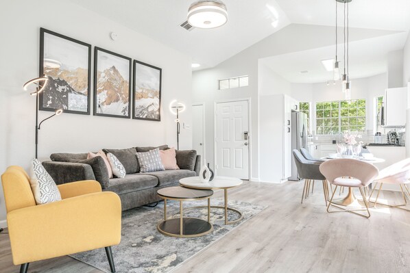 12'tall high ceiling living room wit modem decor. Luxury grey oak color flooring