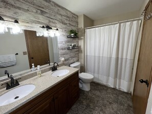 upstairs bathroom off of bedroom 1 and 2.